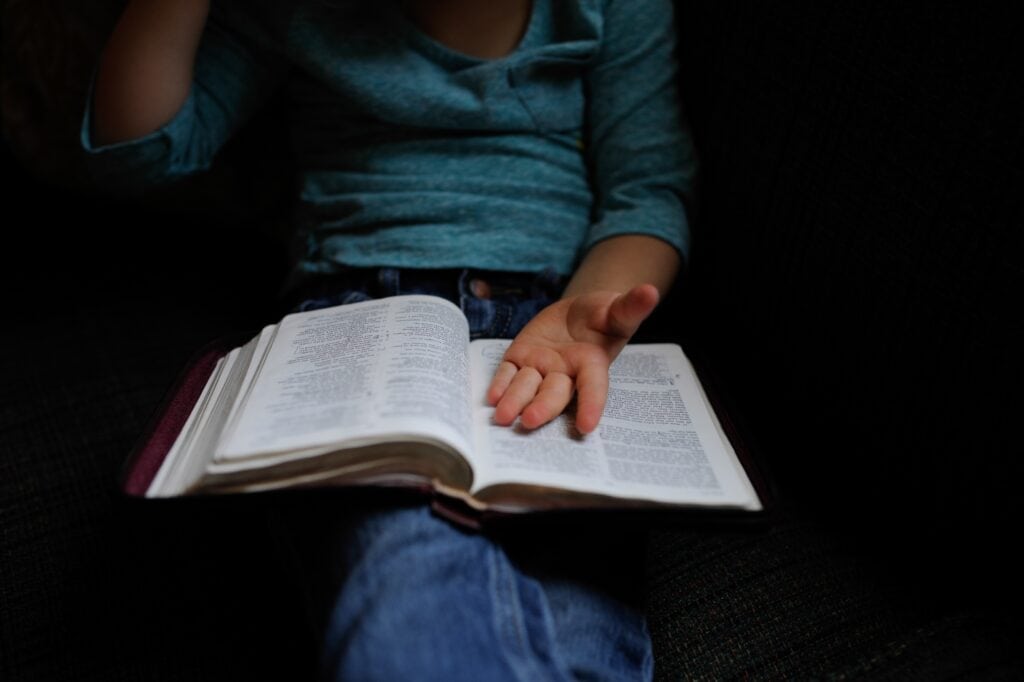 Woman sitting with Bible on lap
