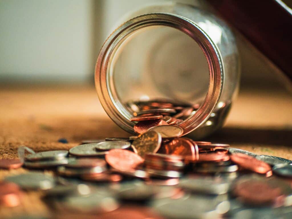 jar with coins spilling out