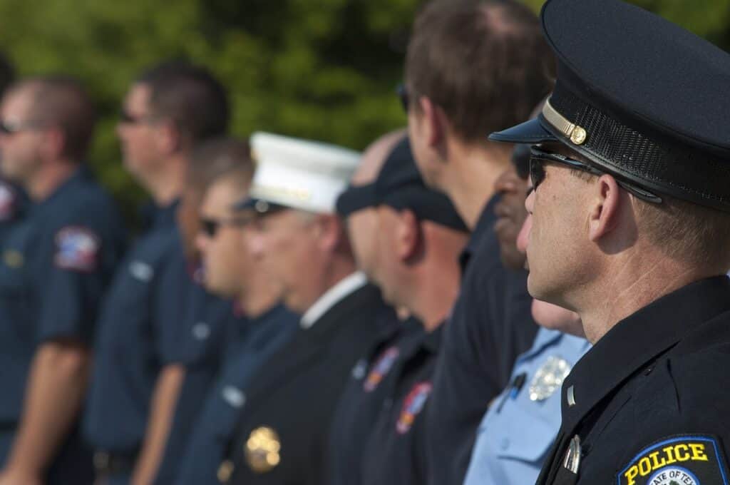 police officers and other civil servants lined up