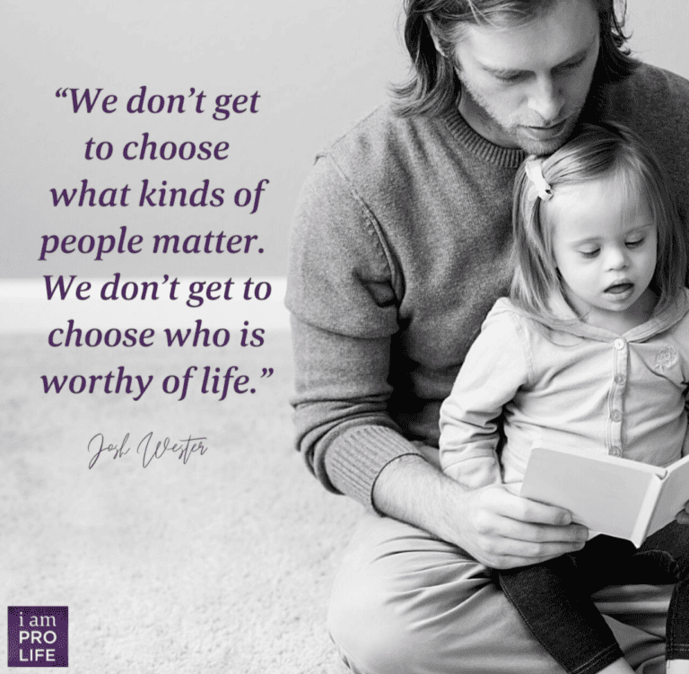 a man holds his daughter with Down syndrome, considering should men have a say in pregnancy and abortion